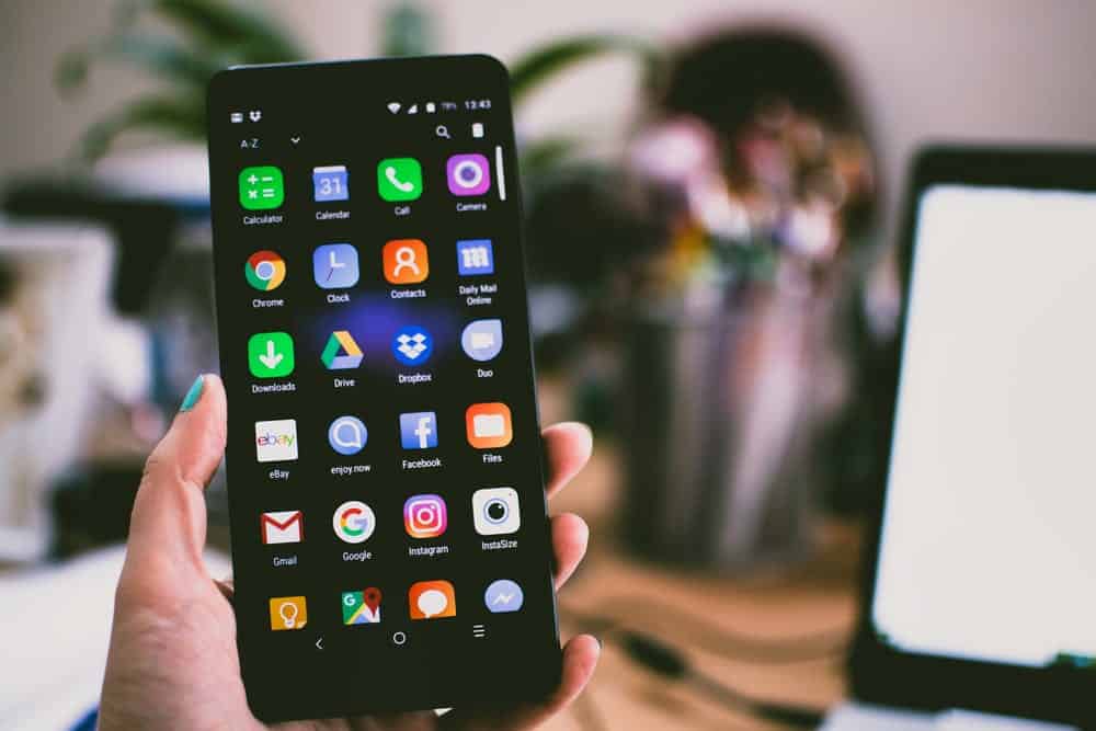 Smartphone displaying various app icons.