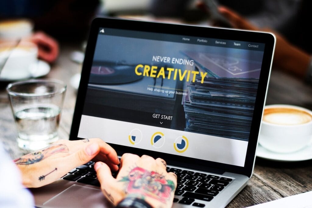 Creative workspace with laptop and coffee